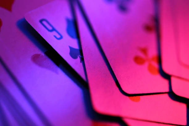 Mobile phone displaying Galactic Gems slot interface with space-themed symbols